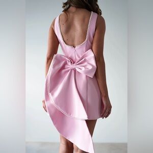 Elegant Pink Dress with Bow and Pearl Details